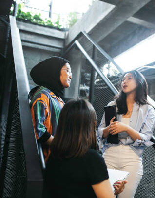Students talking on campus steps